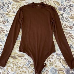 Brown turtle neck long sleeve bodysuit